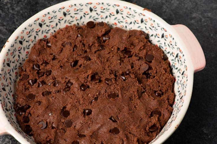 The batter for a chocolate cobble in a baking dish.