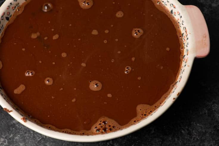 Boiling water poured on top of batter.