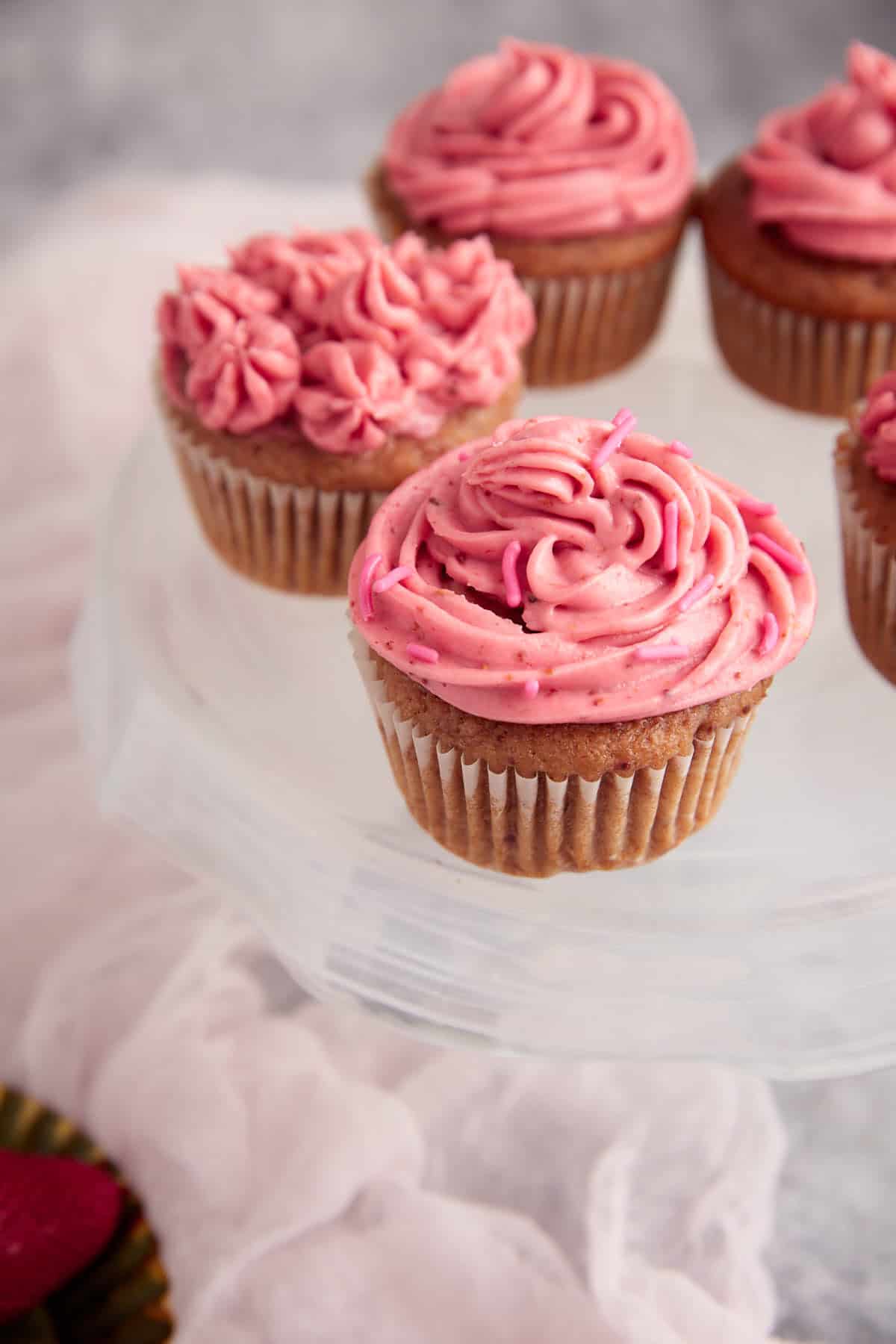 Frosted cupcakes on a cake stand.