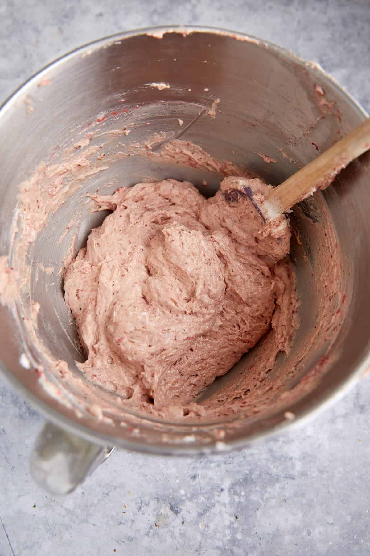 Strawberry cupcake batter in a mixing bowl.