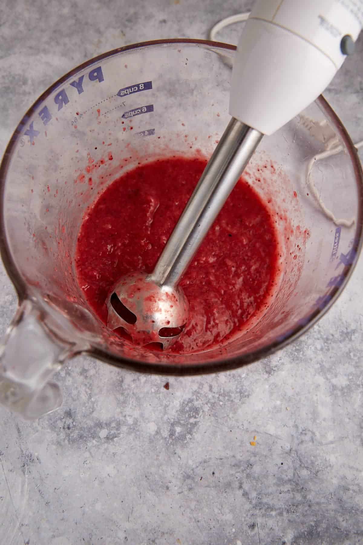 Pureed strawberries with an immersion blender.