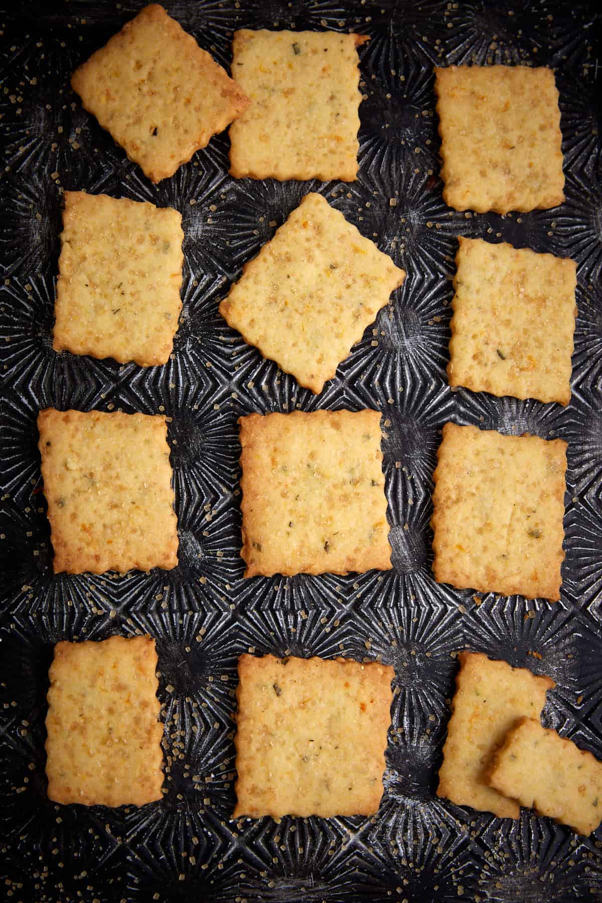 Square shortbread cookies on a tray.