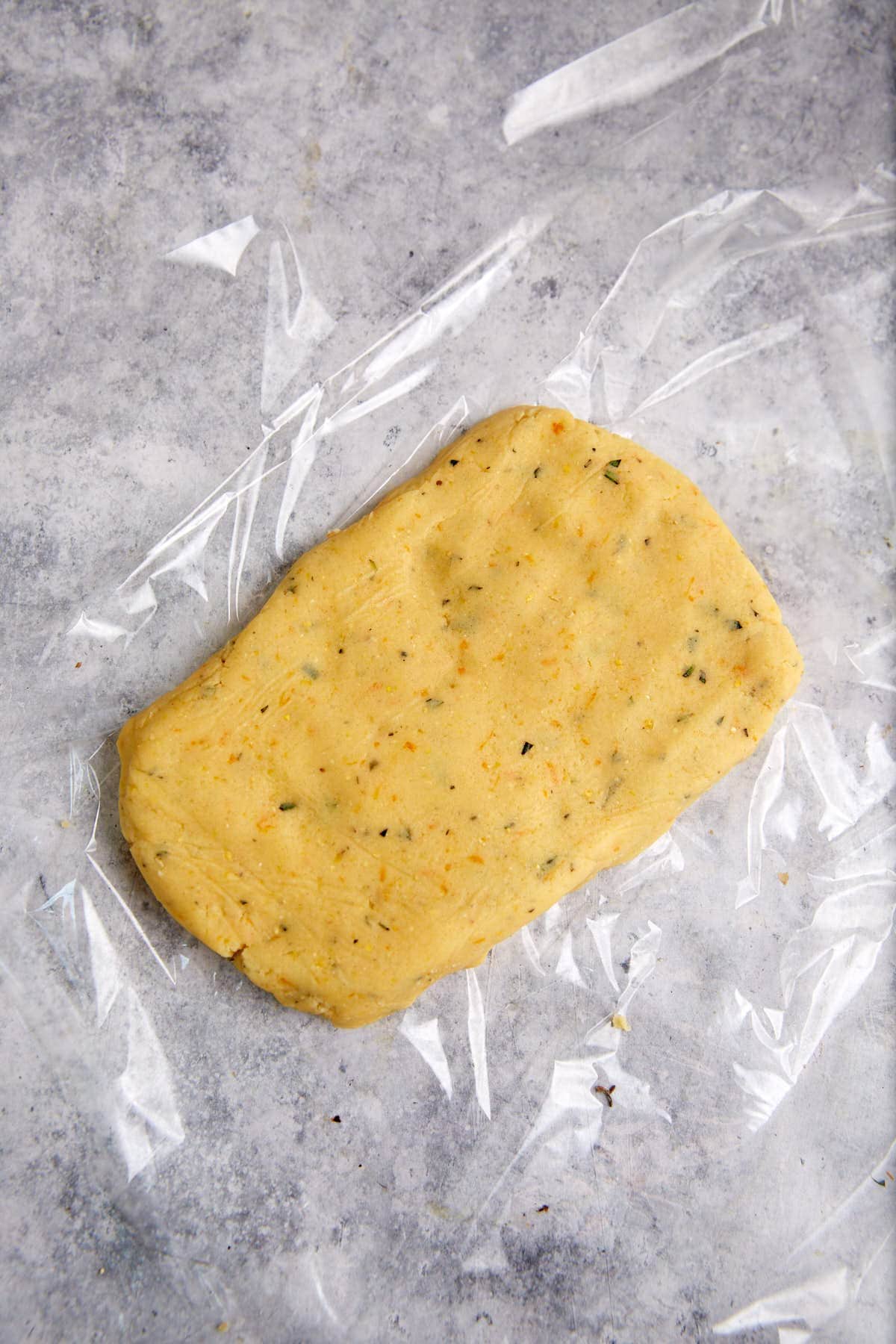 Shortbread dough flattened into a square.