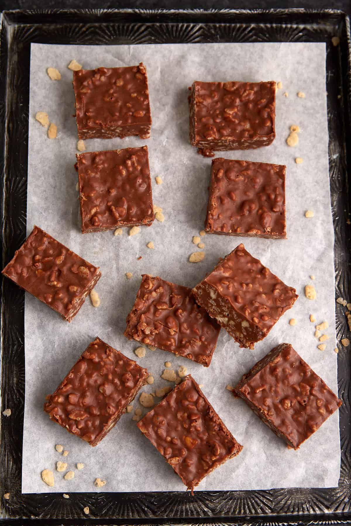 Chocolate rice krispie squares on a tray.