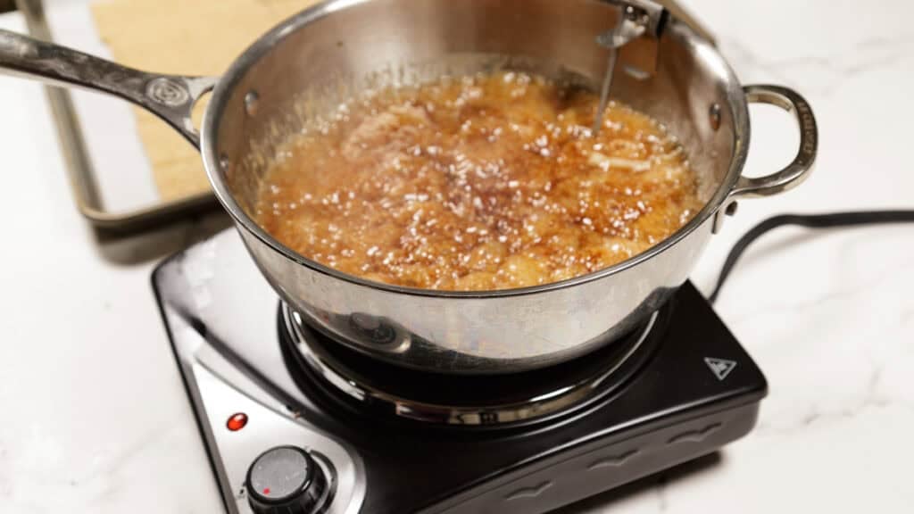 Brown sugar and butter cooking in a saucepan.