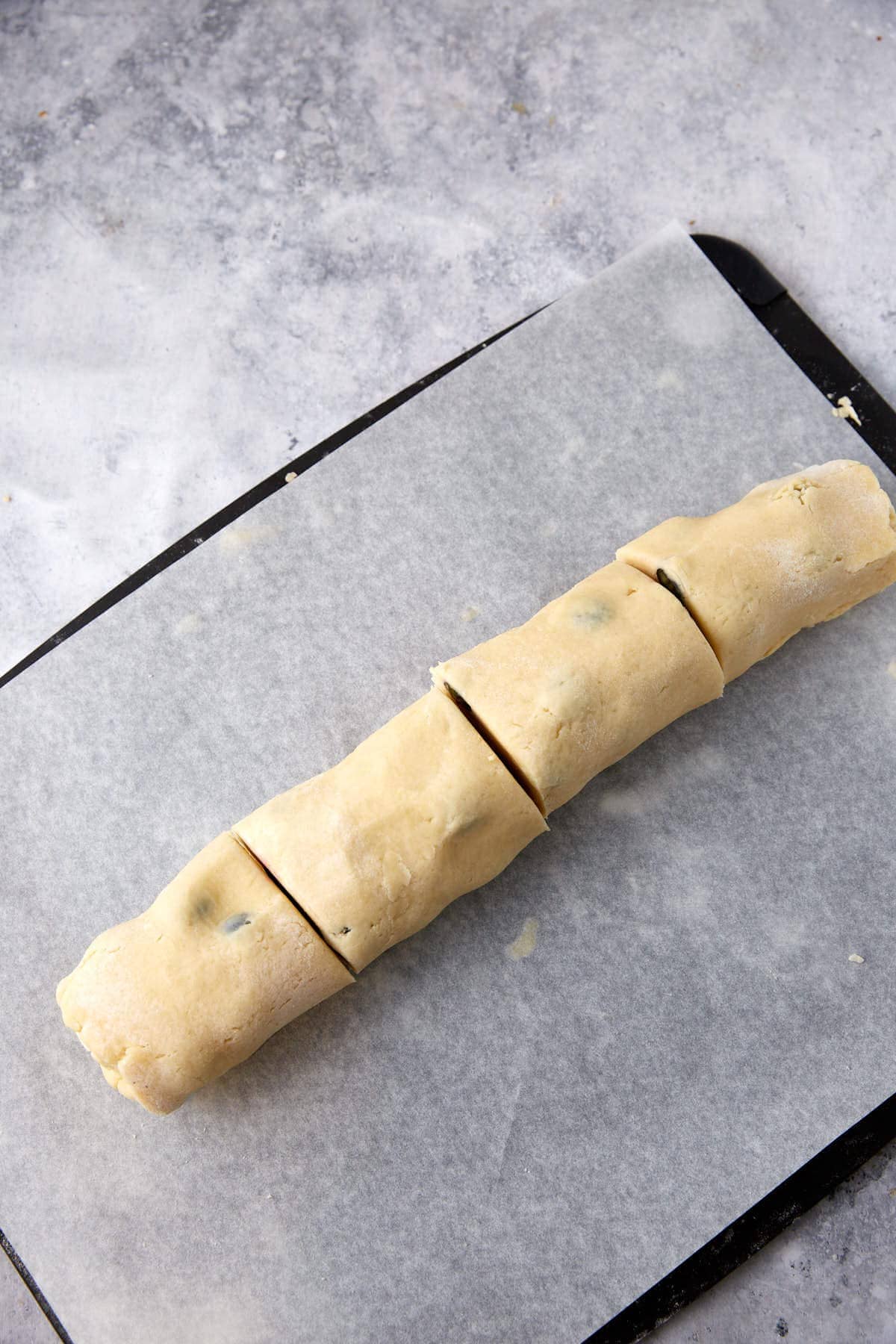 Scone dough rolled up and cut.