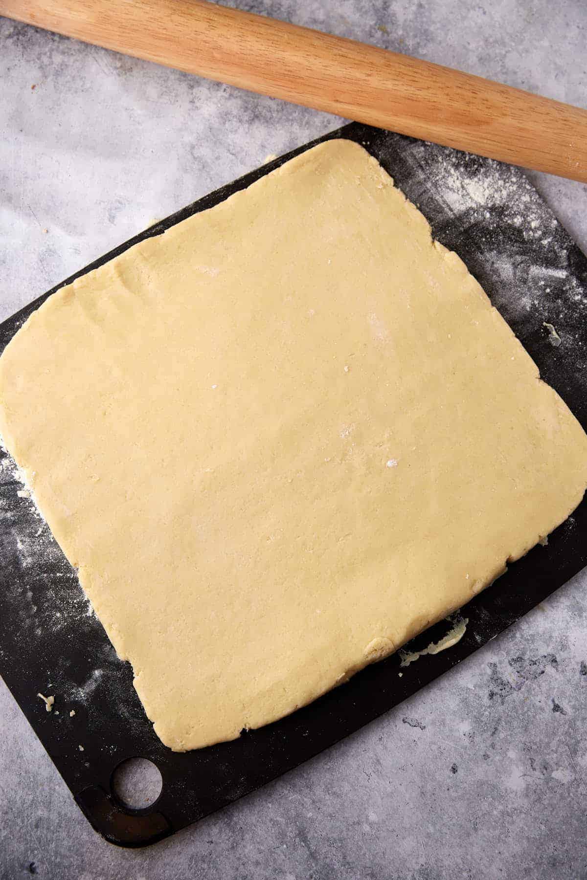 Scone dough rolled out into a square.