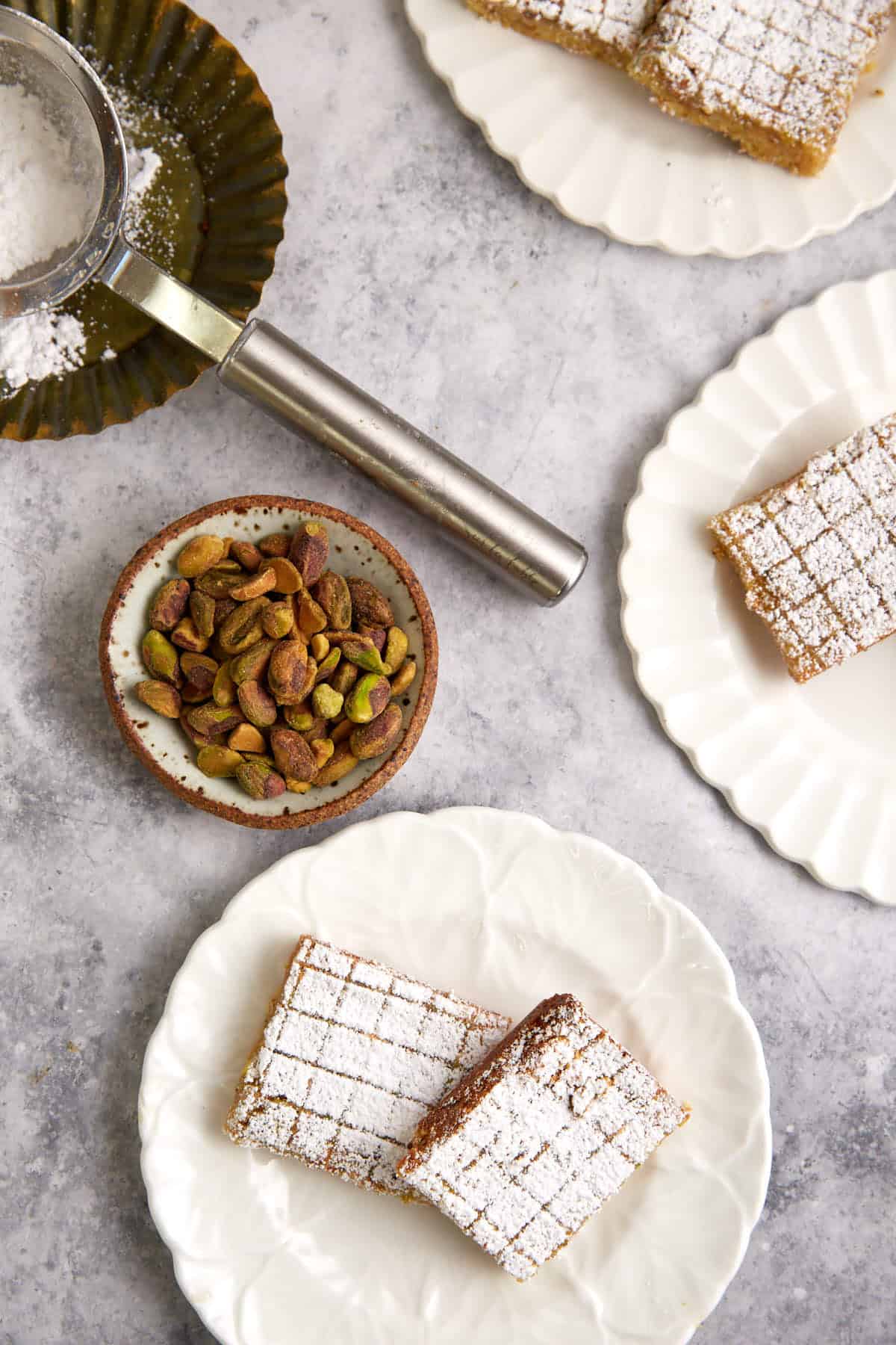 pistachio lemon bars on a plate.