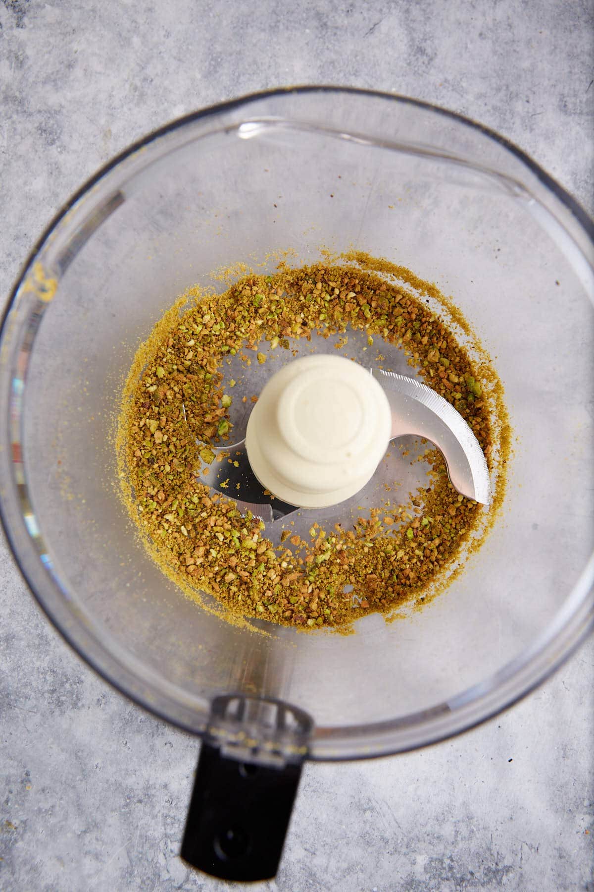 Pistachios ground in a food processor.