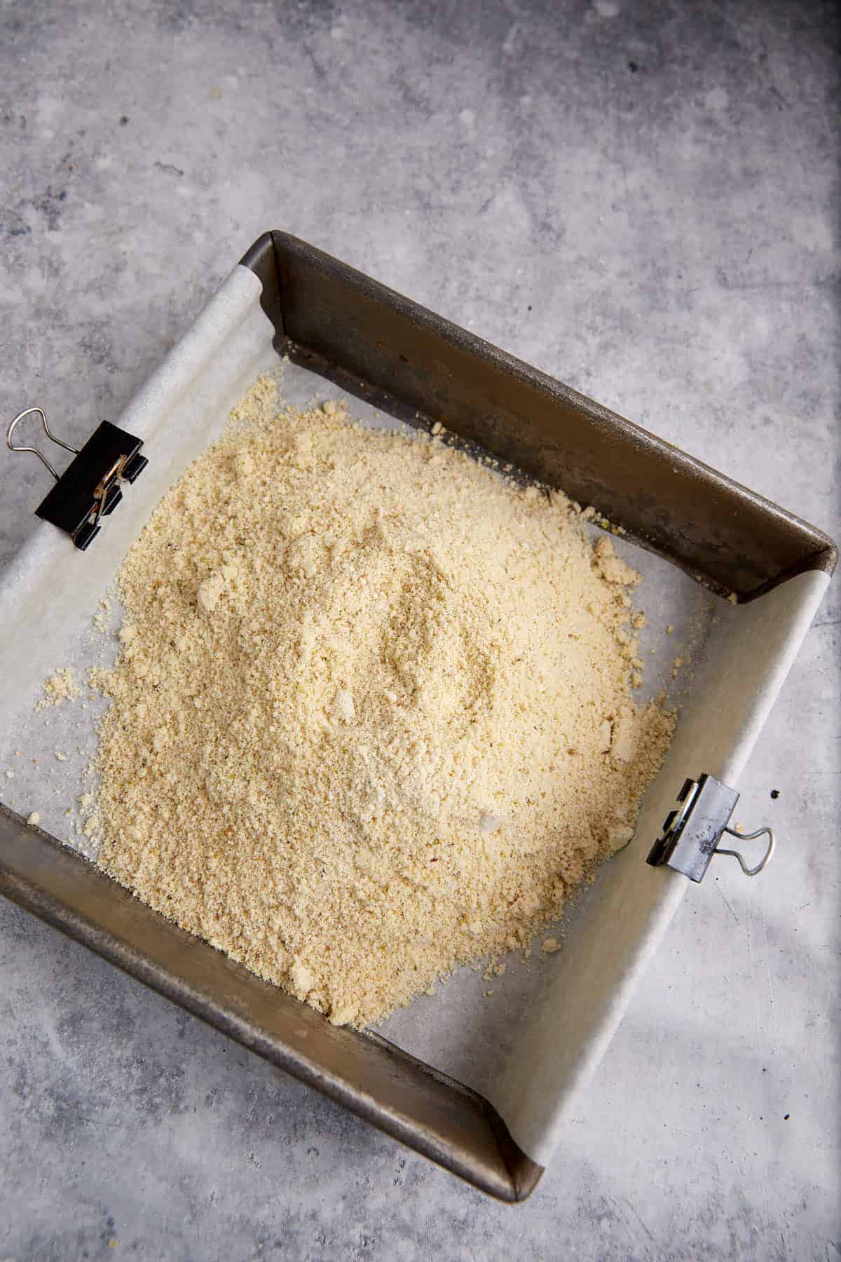 Shortbread dough in a baking pan.