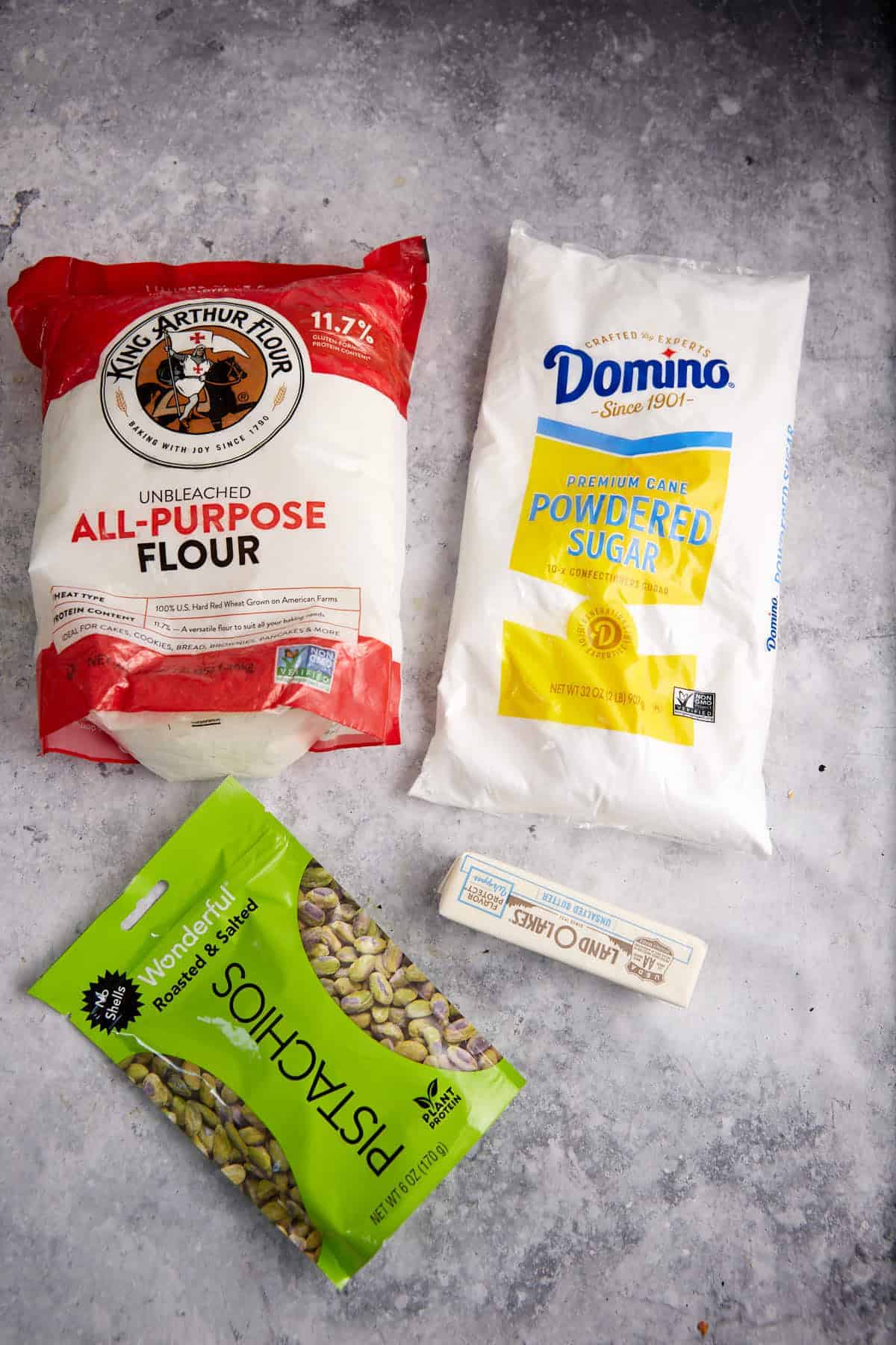 Ingredients for a pistachio shortbread crust.