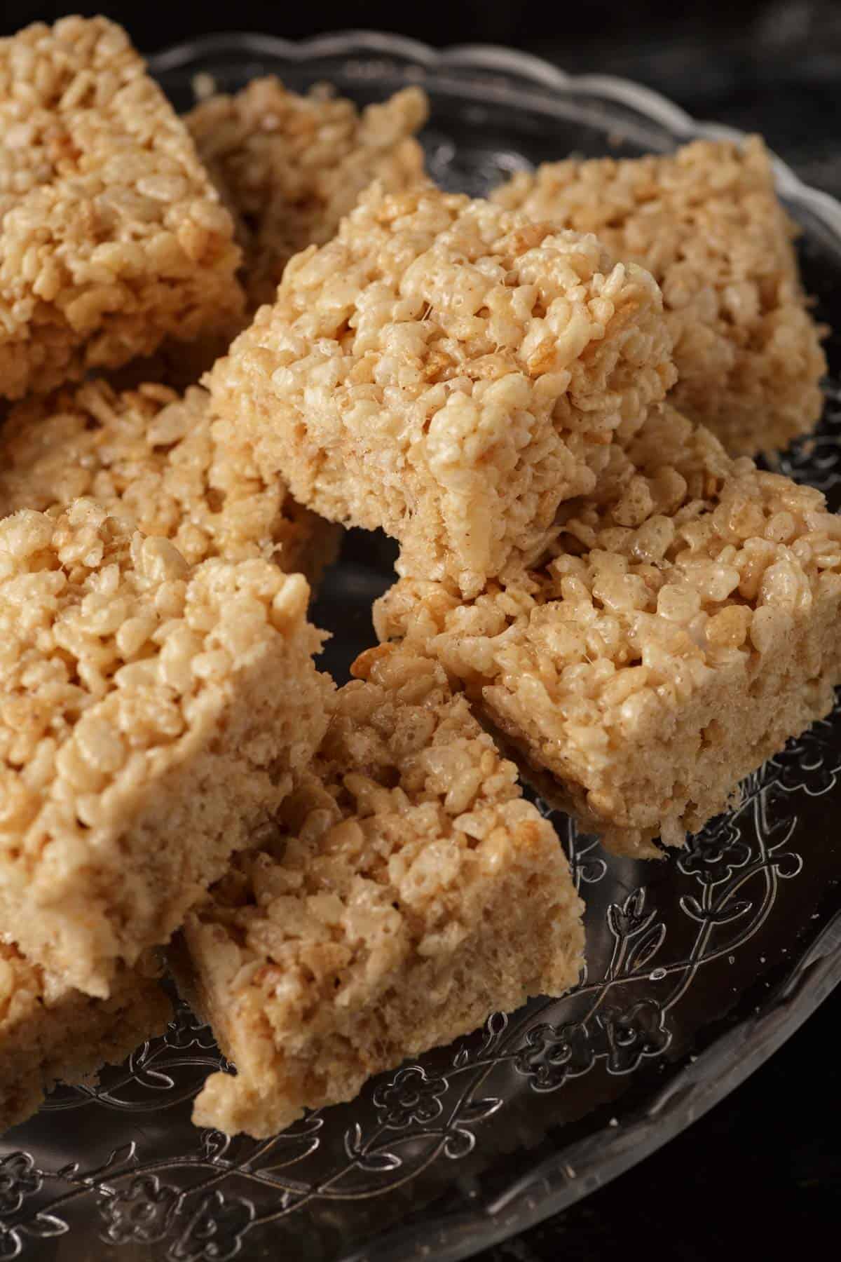 A platter stacked with brown butter rice krispies.