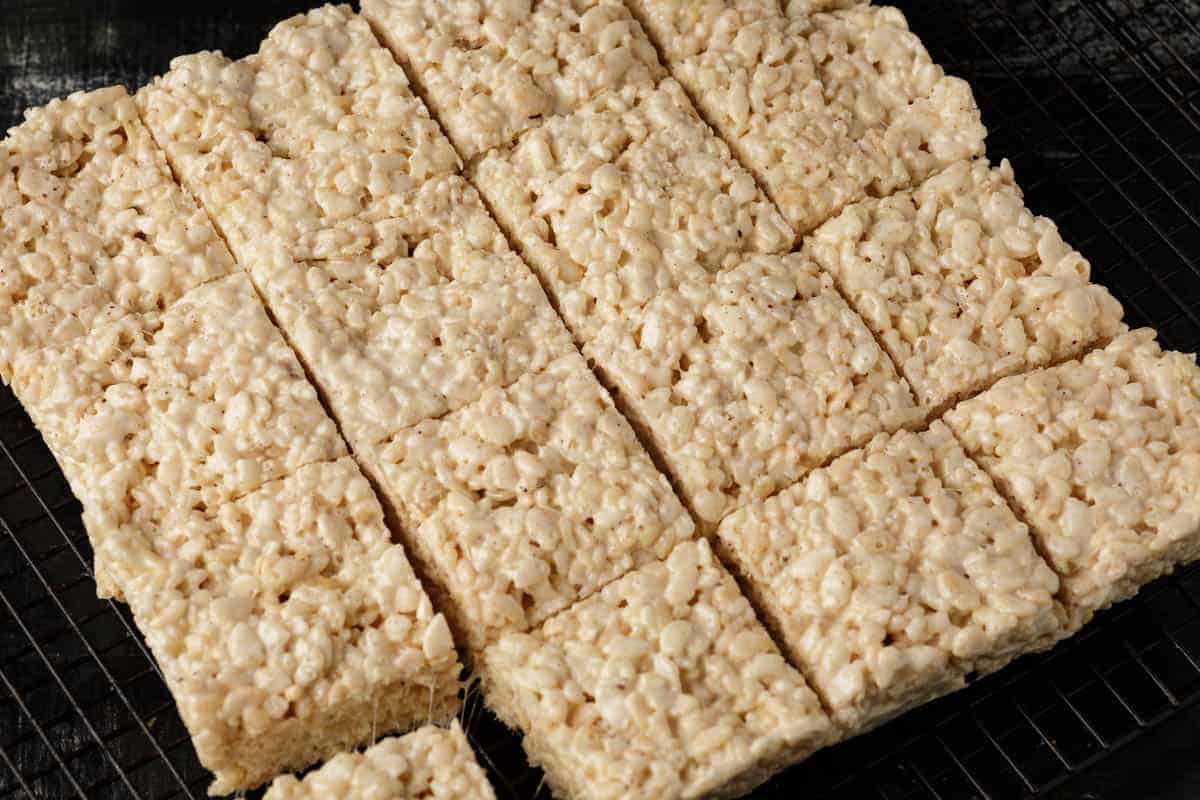 A batch of brown butter rice krispie treats cut into squares.