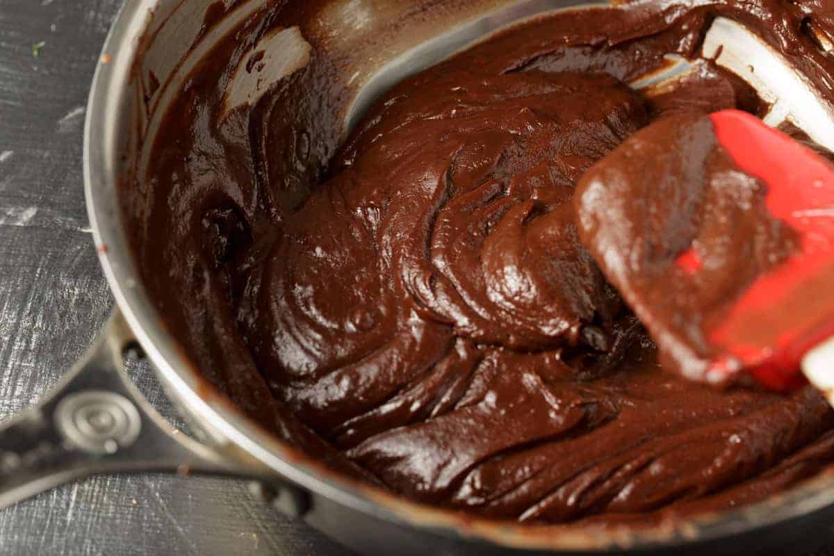 Cooked chocolate filling in a saucepan.
