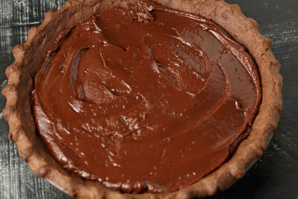 Chocolate filling on top of cherries.