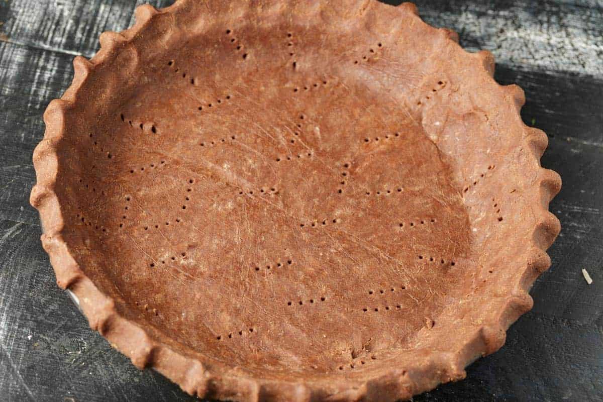 A chocolate pie crust that has been baked.