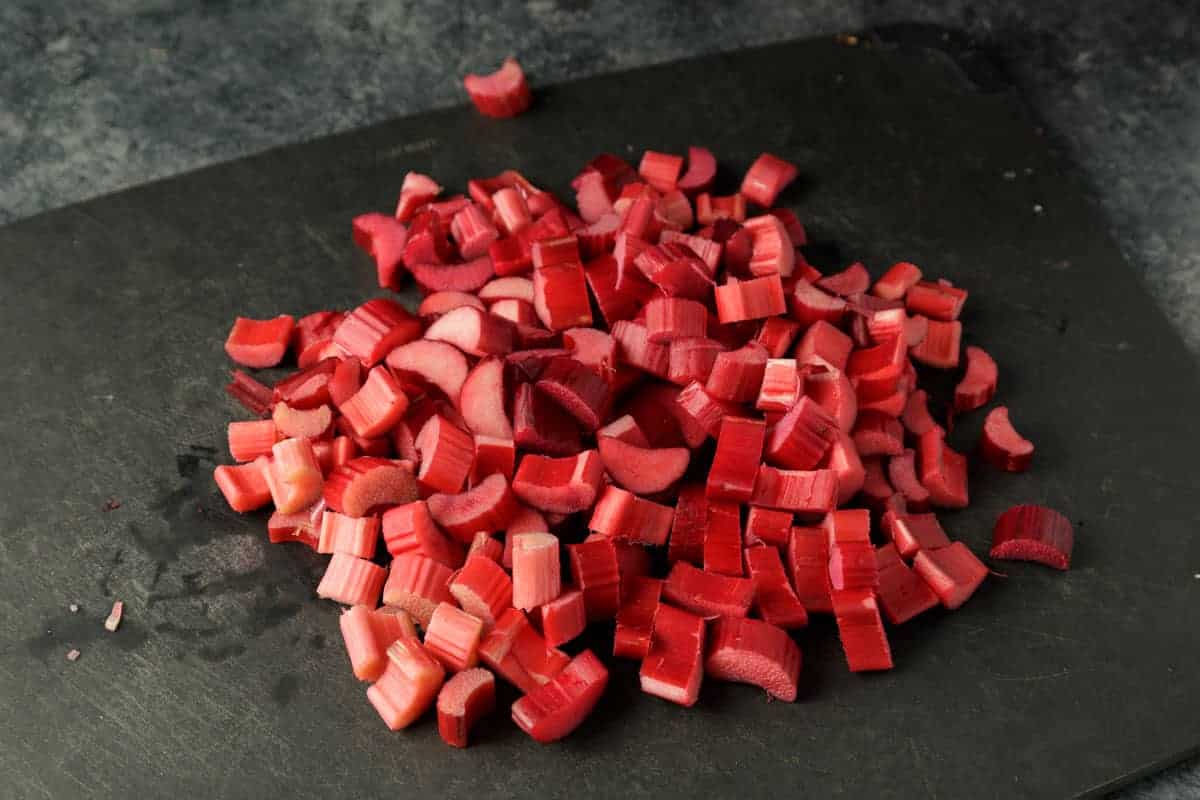 Chopped rhubarb on a cutting board.