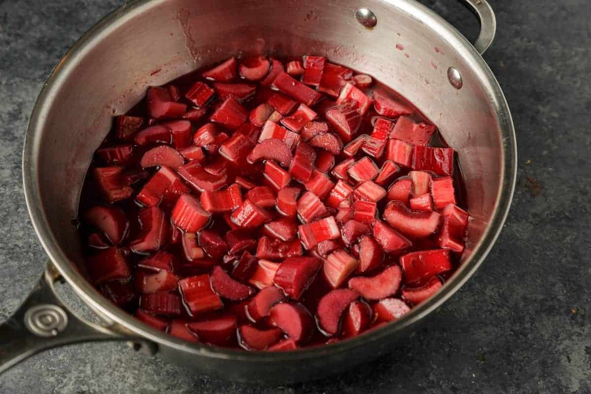 Rhubarb added to a saucepan to cook.