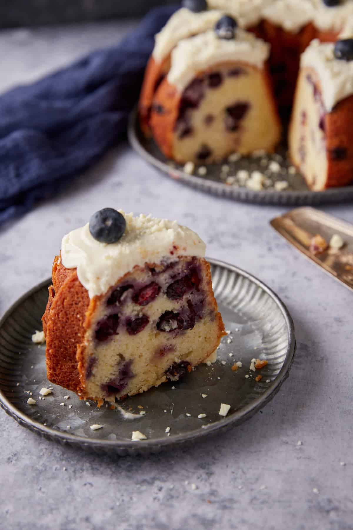 A single slice of blueberry cake.