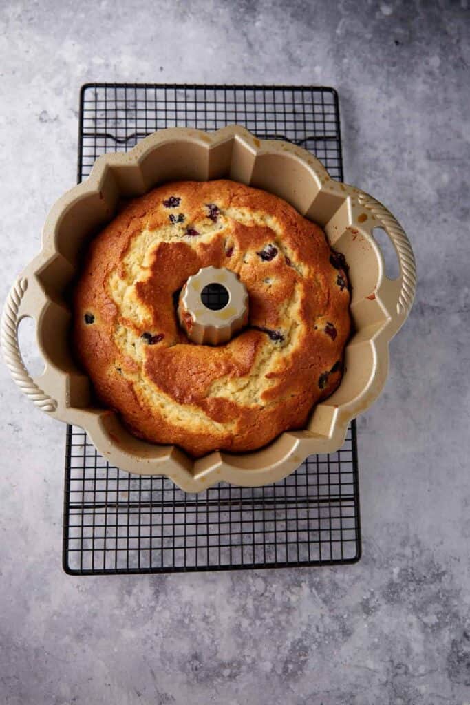 A baked bundt cake in a bundt pan.