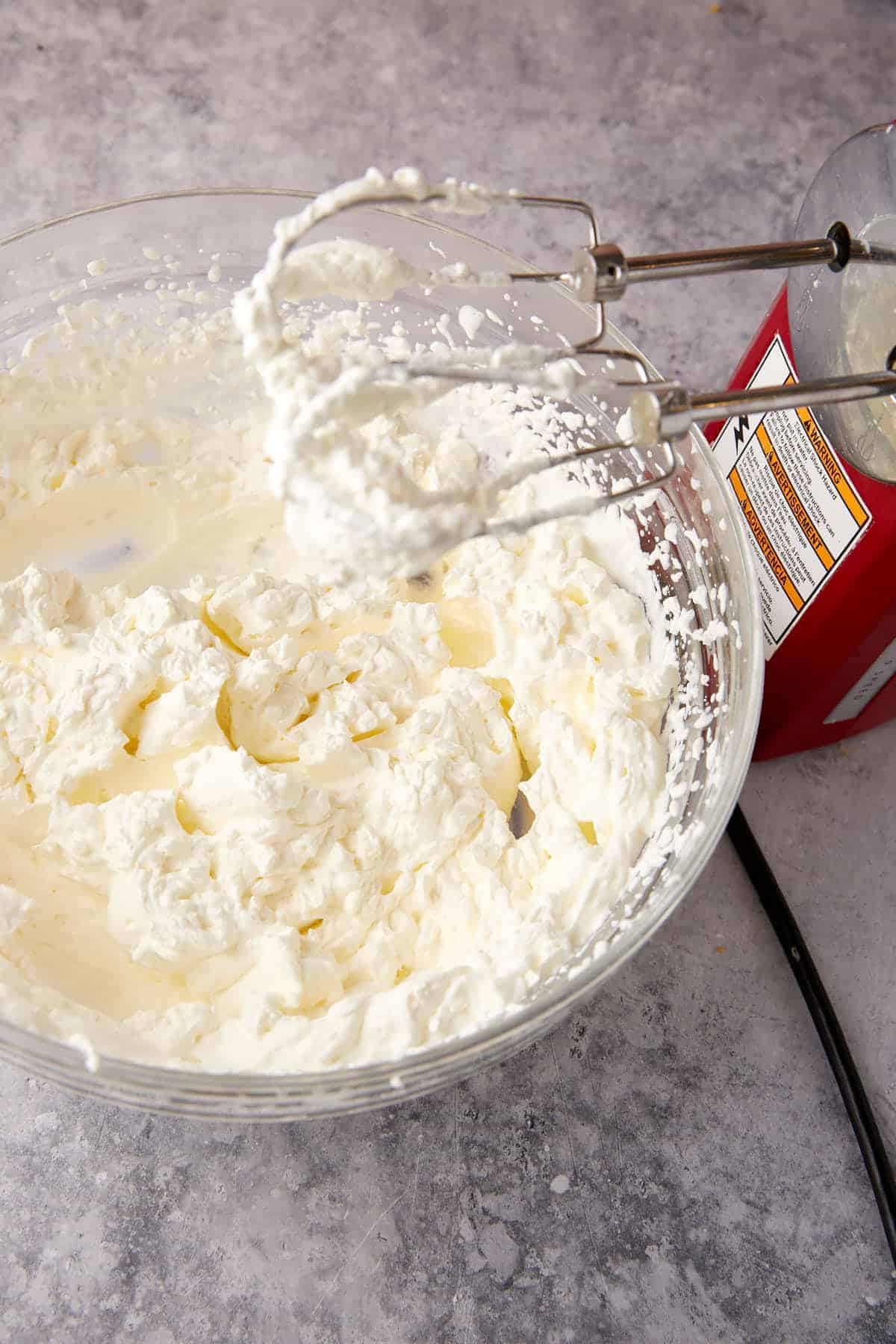 Whipped cream in a mixing bowl.