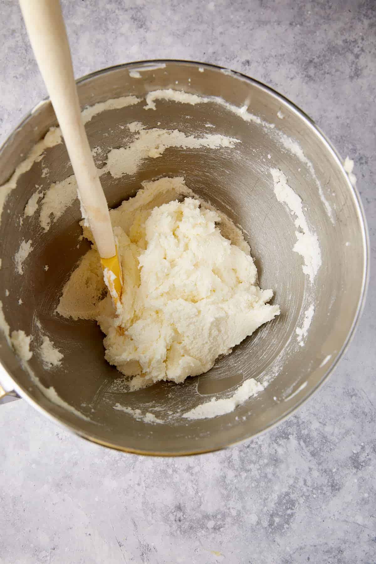 Butter and sugar creamed in a mixing bowl.
