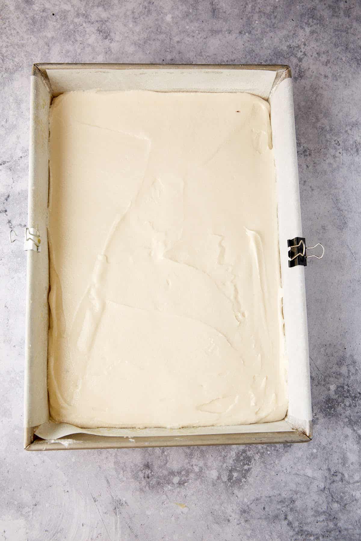 Cake batter in a cake pan.