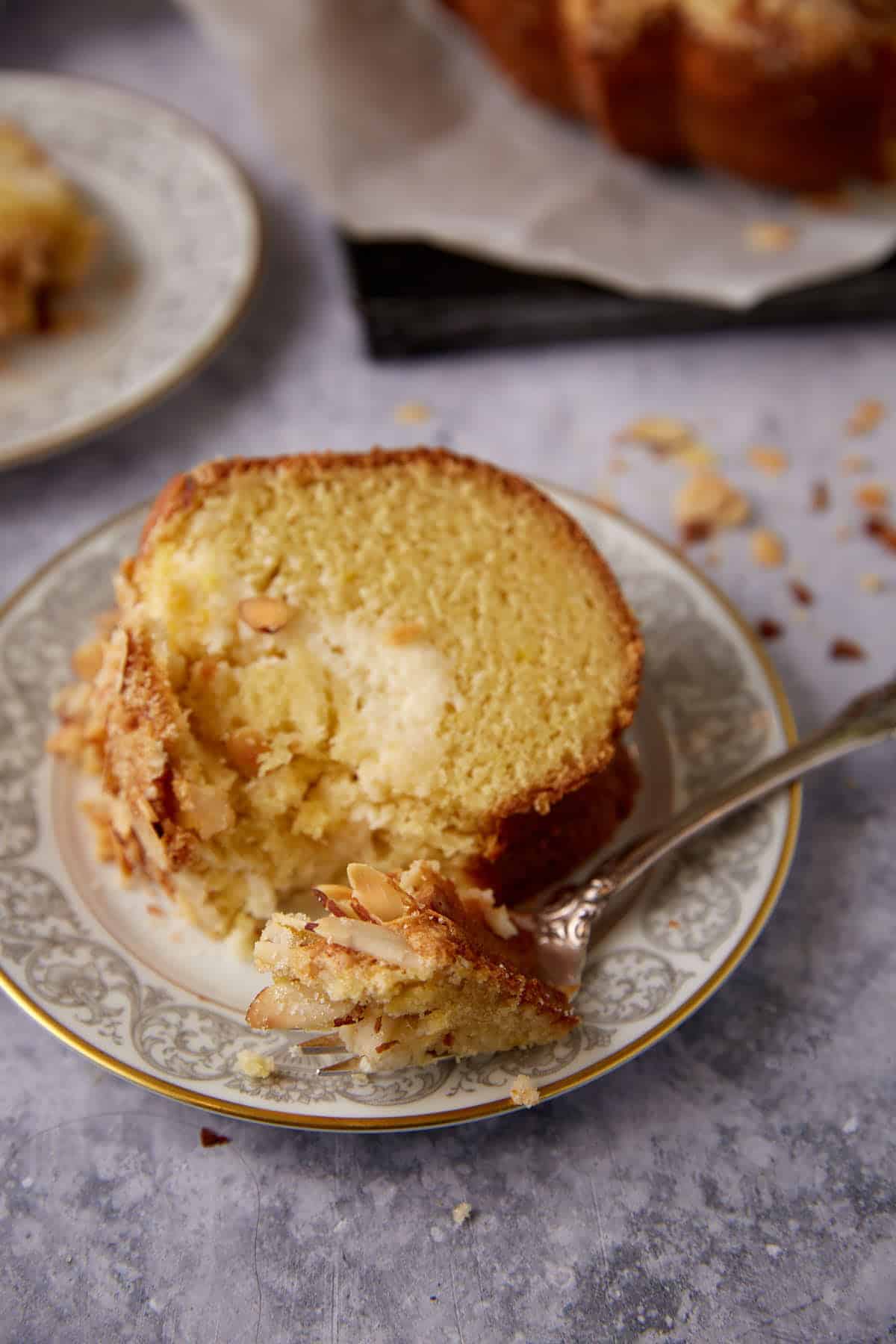 A slice of coffee cake with a bite taken out.