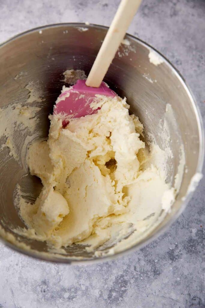 Butter and sugar creamed together in a bowl.