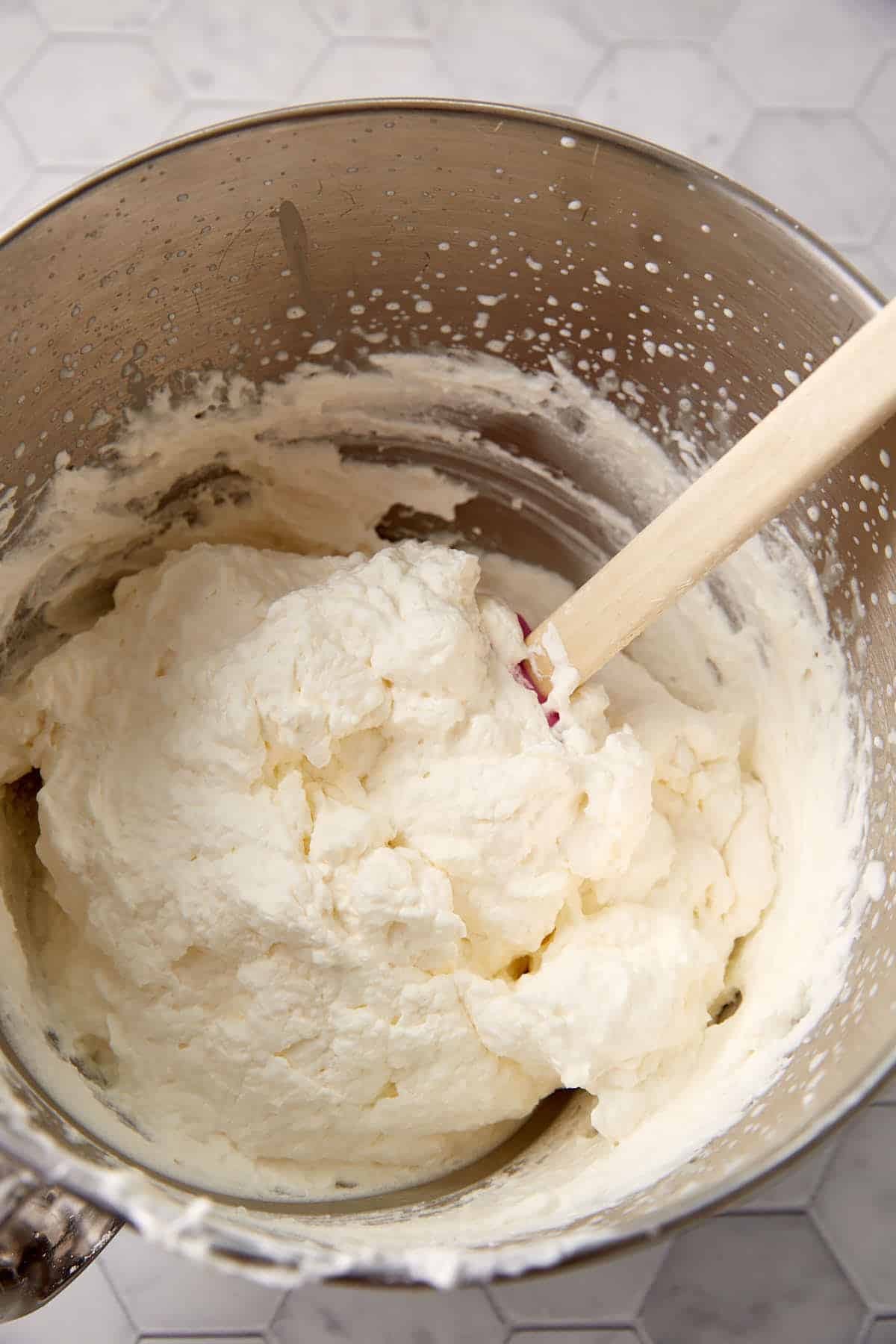 Stabilized whipped cream in a mixing bowl.