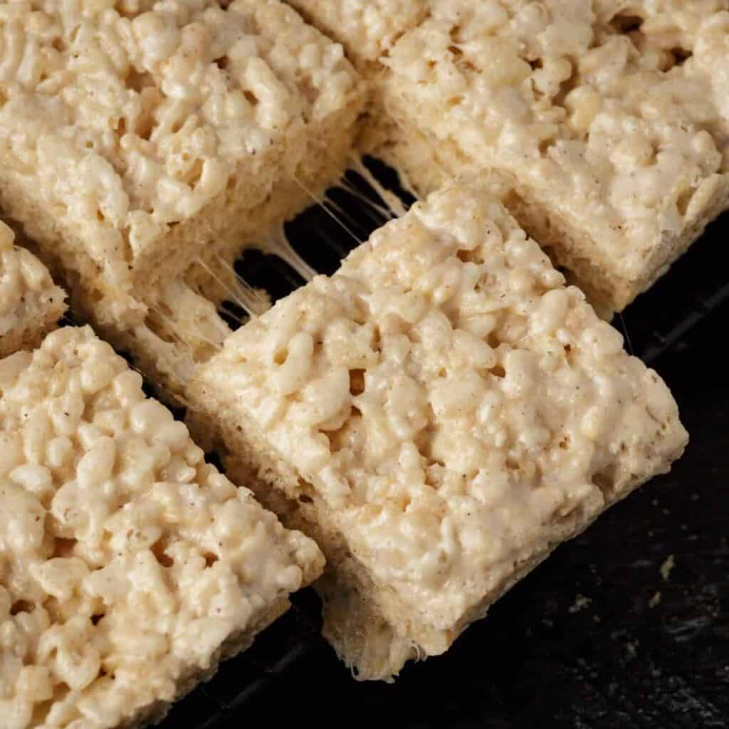 Brown butter rice krispie treats being pulled apart.