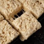 Brown butter rice krispie treats being pulled apart.