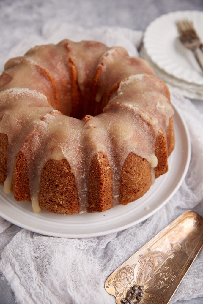 A frosted butter cake on a plate.