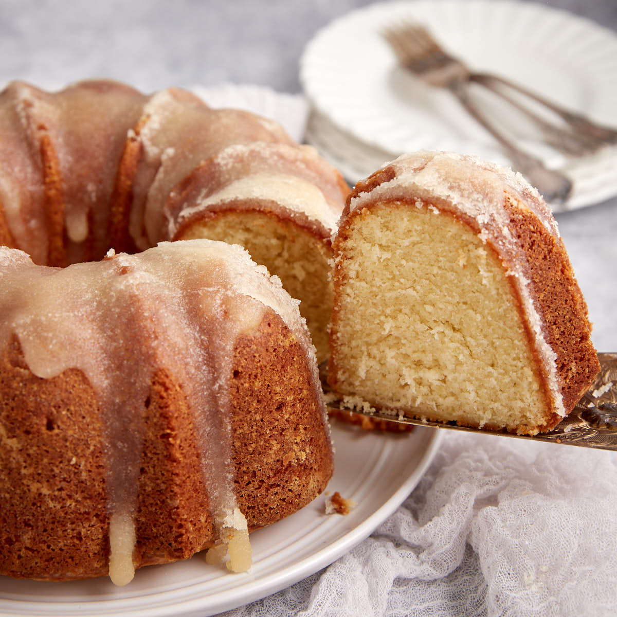 A slice of butter cake being removed.