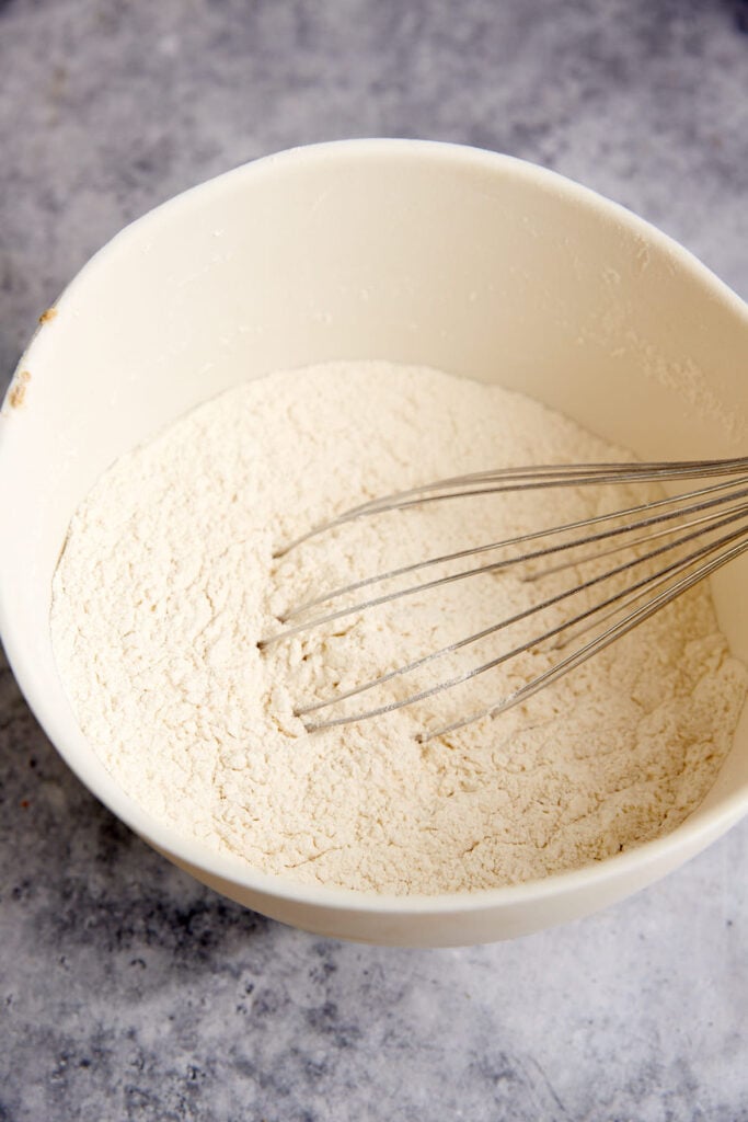 Teh dry ingredients in a bowl with a whisk.