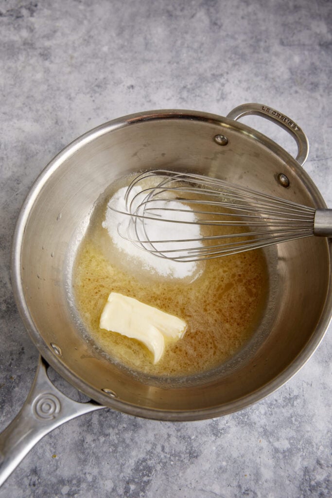 The butter glaze in a saucepan.