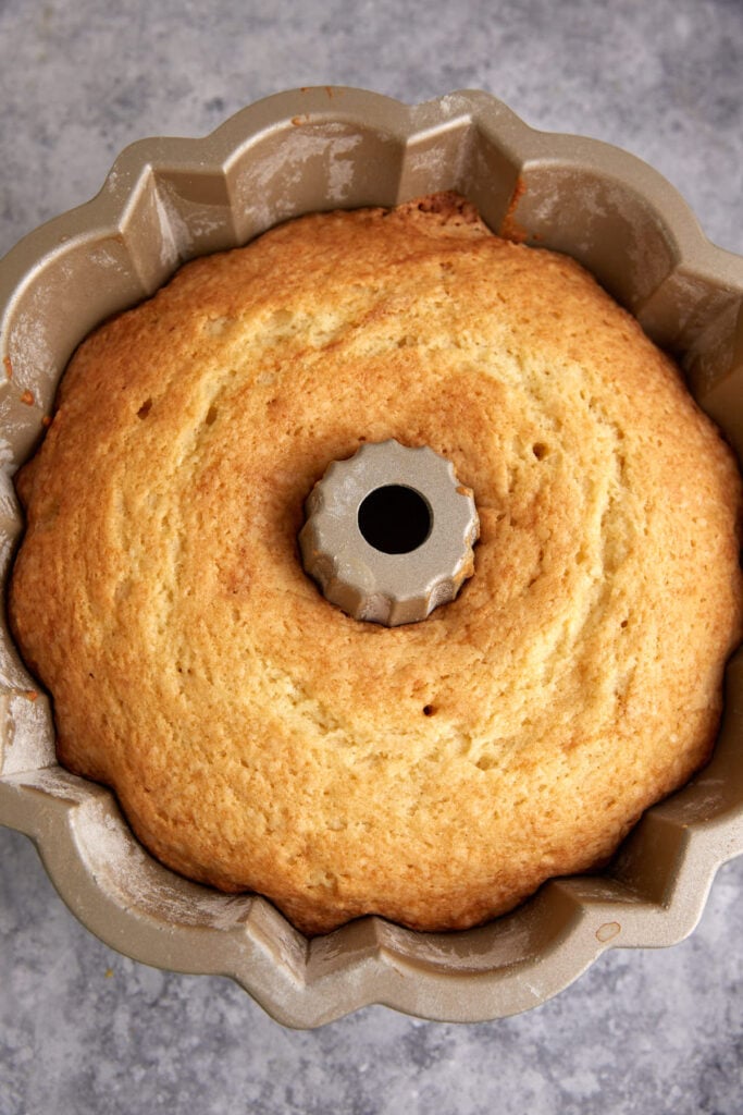 A baked butter cake in a bundt pan.