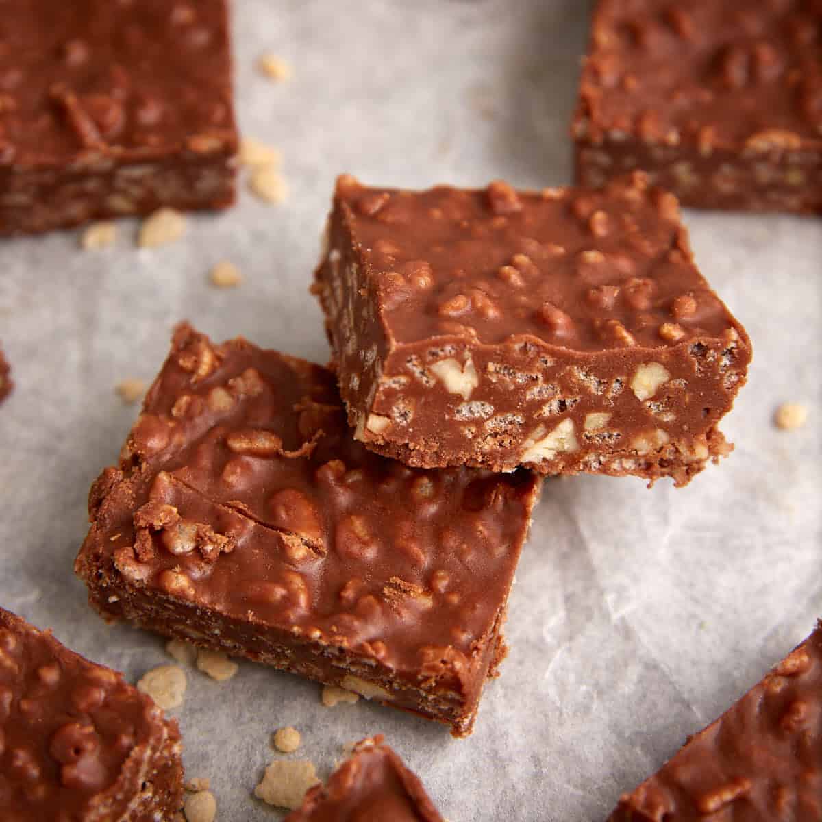 chocolate rice krispie squares on parchment paper.