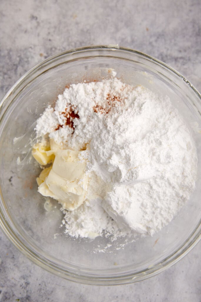 The ingredients for the frosting in a bowl.