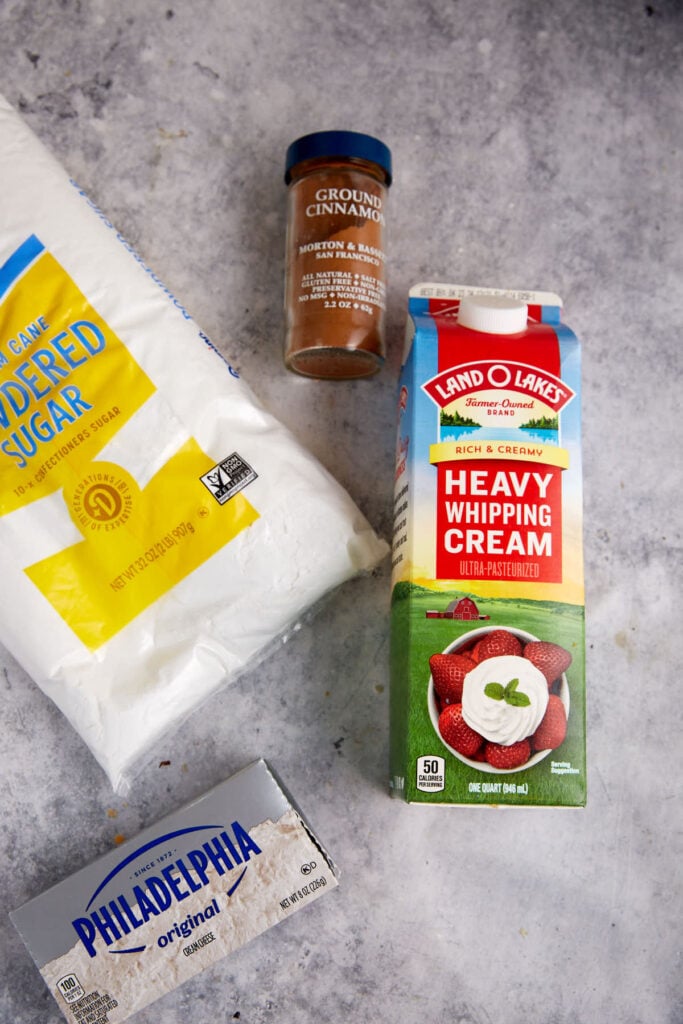 The ingredients for a cinnamon cream cheese frosting.