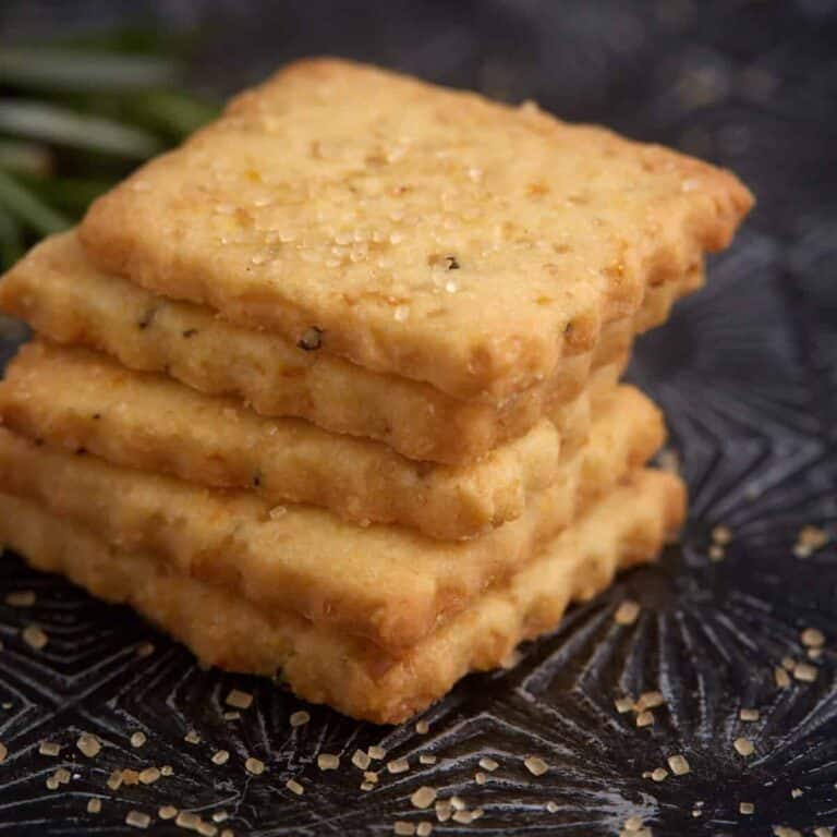 A stack of orange shortbread cookies.