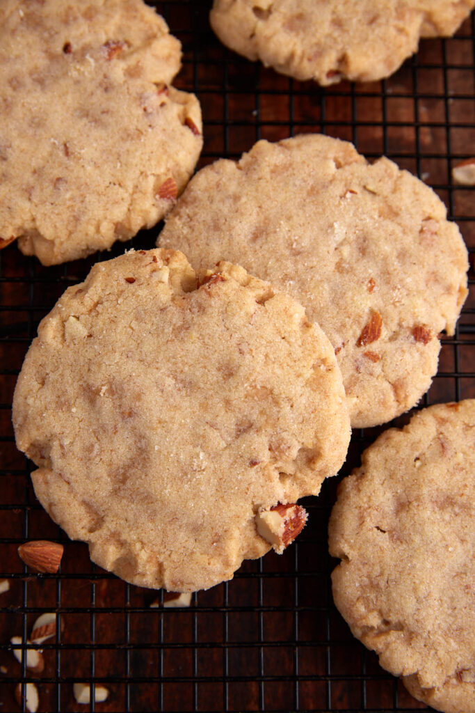 Two baked almond sugar cookies.