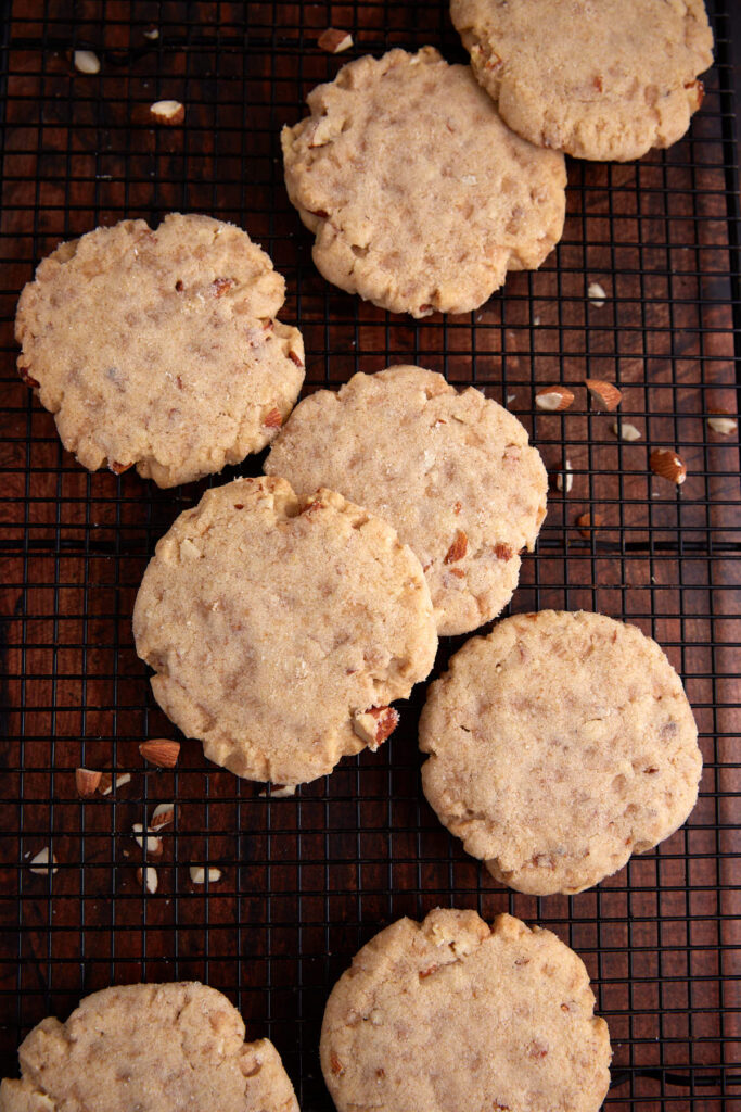 Almond sugar cookies on a cooling rack.