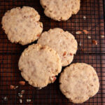 Almond butter cookies cooling on a rack.