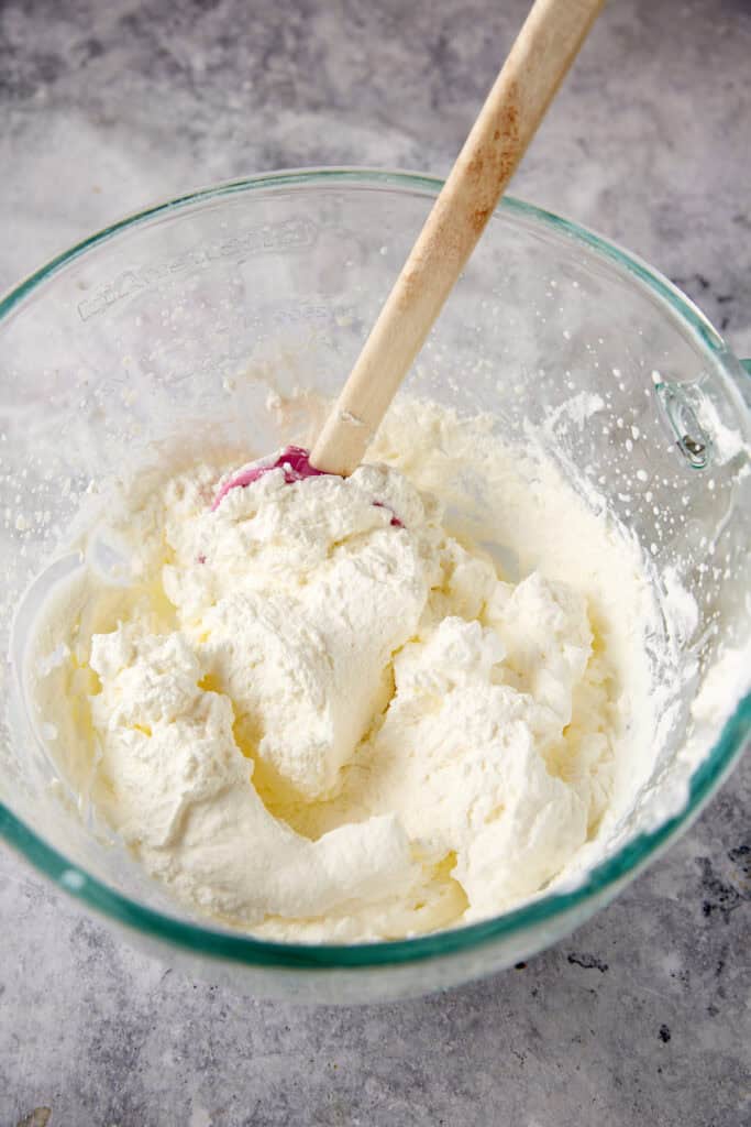 Whipped cream in a mixing bowl.
