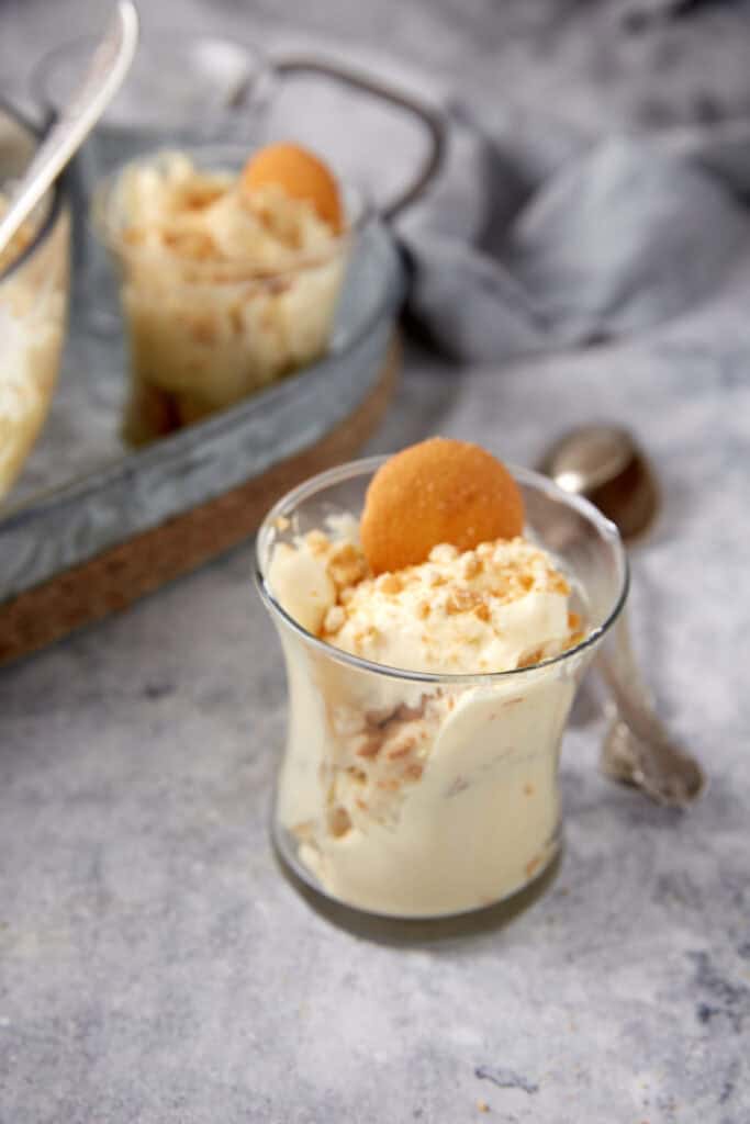 An individual serving of banana pudding with condensed milk.