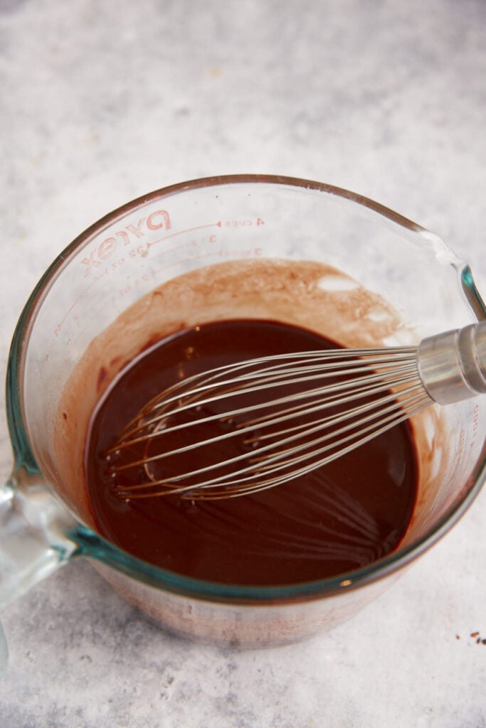 Melted chocolate and butter in a bowl.