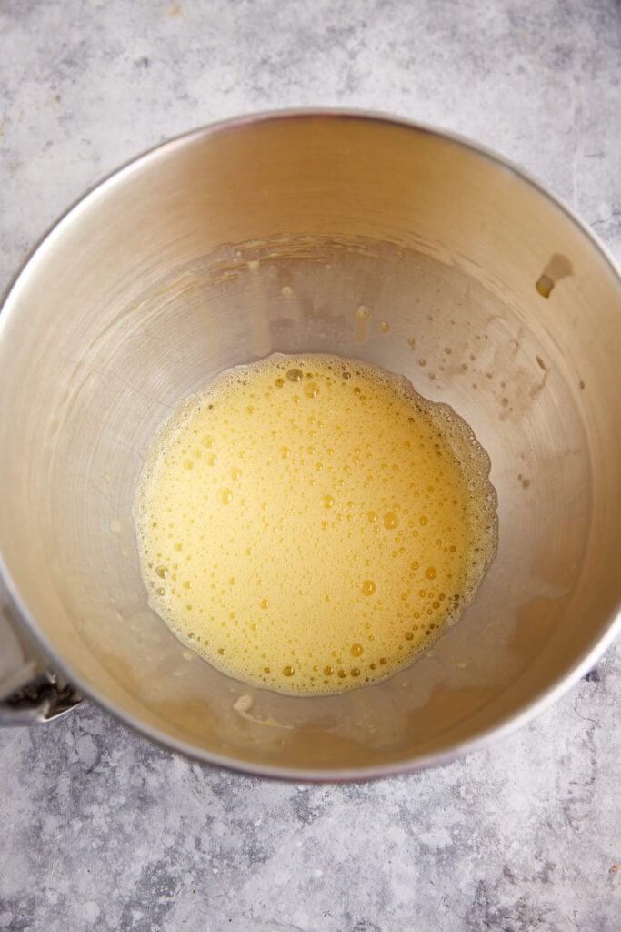 Eggs beaten in a mixing bowl.