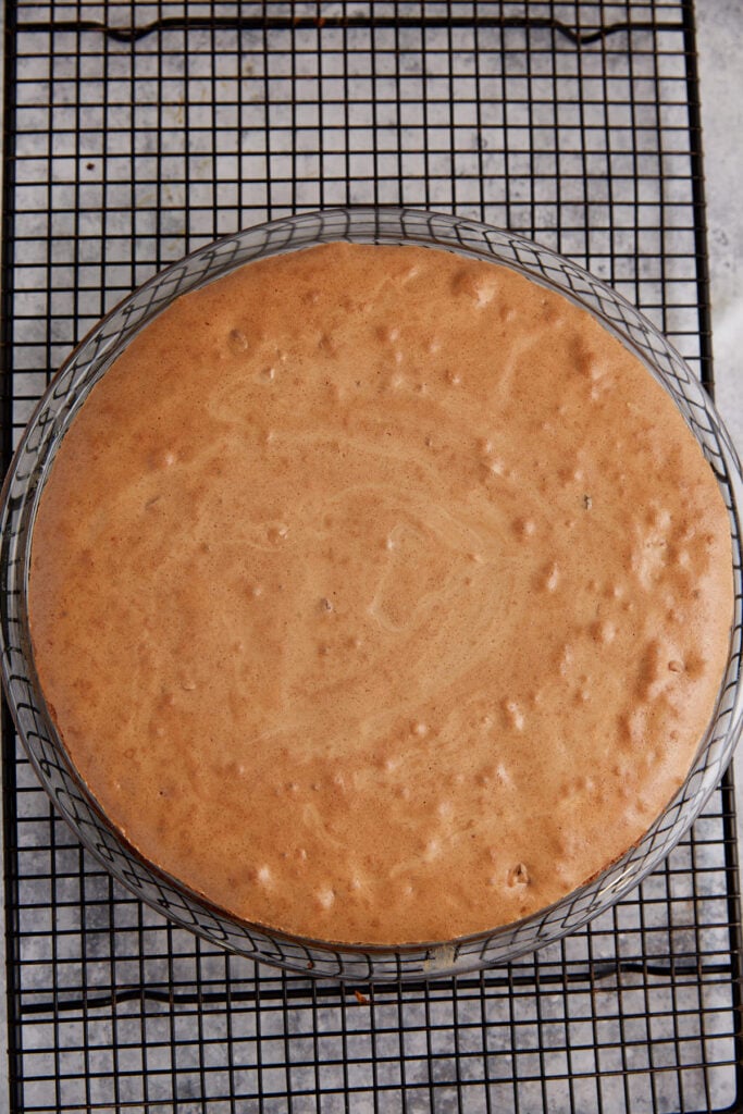A baked brownie pie on a cooling rack.