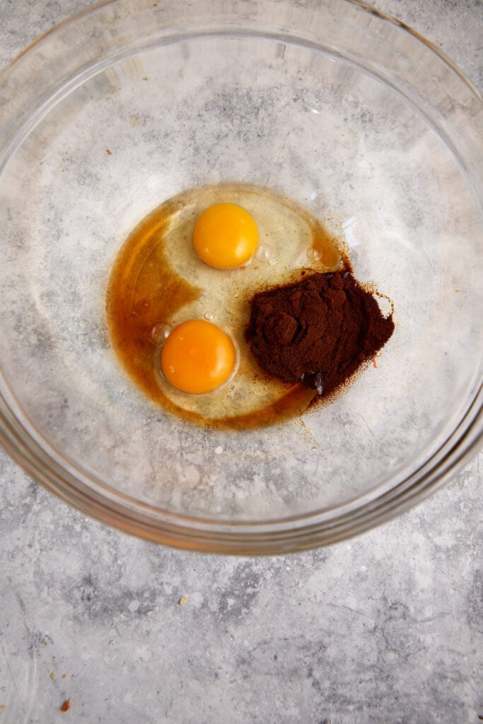 A bowl of eggs and espresso powder.